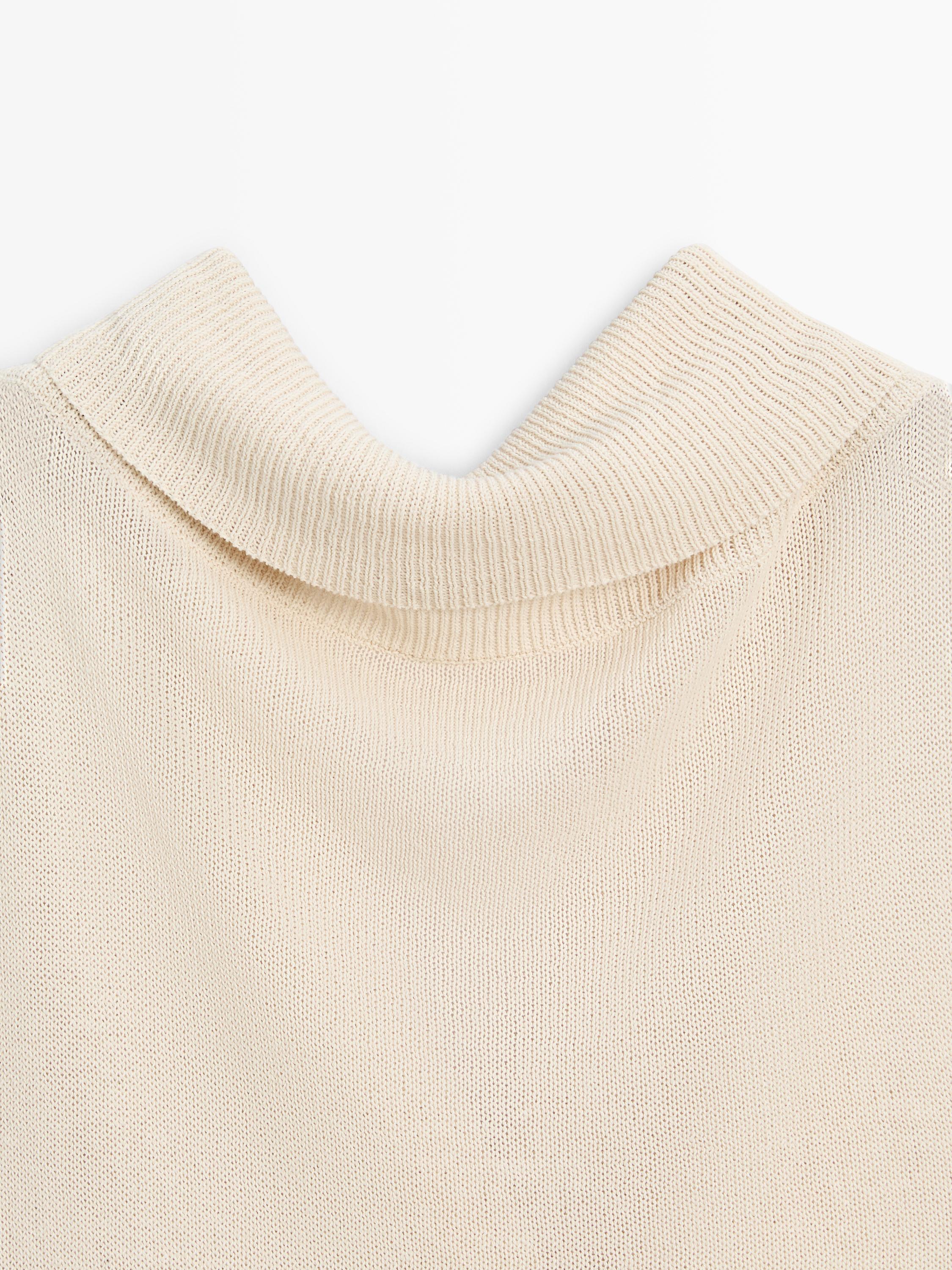 Knit sweater with low-cut back